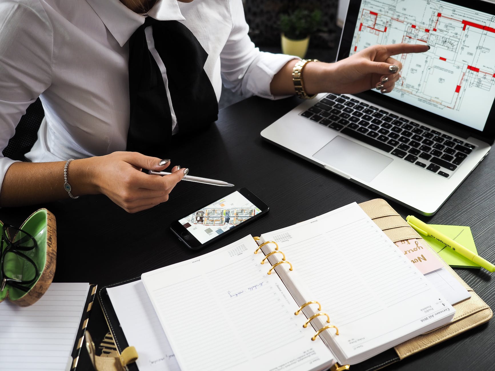 How to Find a Great Real Estate Agent in 2023 2 person pointing on the screen of a laptop